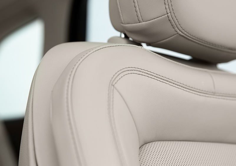 Fine craftsmanship is shown through a detailed image of front-seat stitching. | North Park Lincoln at Dominion in San Antonio TX